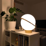 modern-asymmetrical-crescent-table-lamp-with-gold-interior-and-acrylic-globe