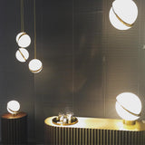 modern-asymmetrical-crescent-table-lamp-with-gold-interior-and-acrylic-globe