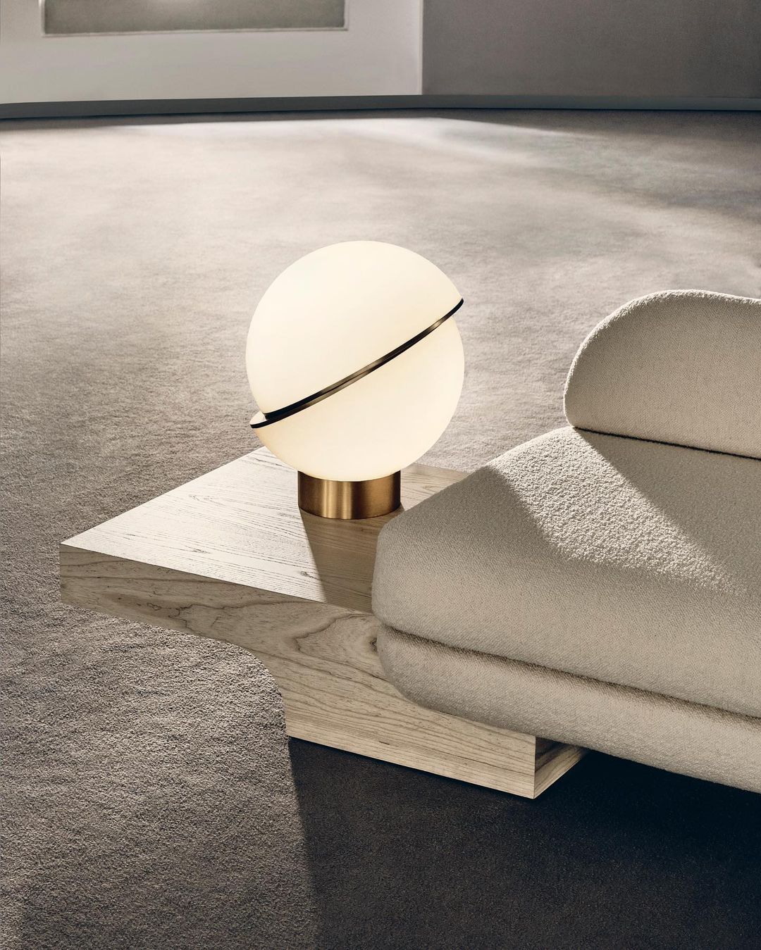 modern-asymmetrical-crescent-table-lamp-with-gold-interior-and-acrylic-globe