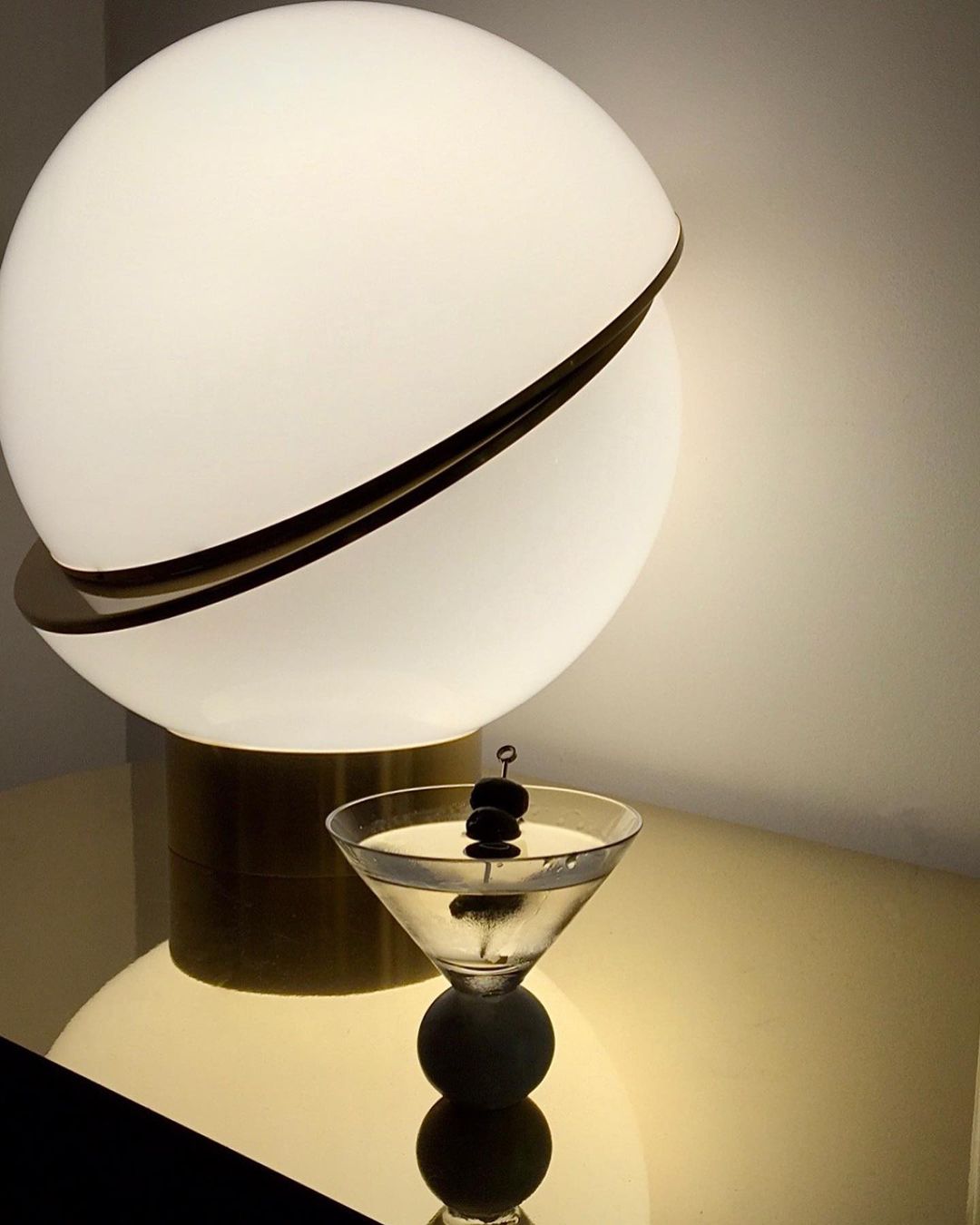 modern-asymmetrical-crescent-table-lamp-with-gold-interior-and-acrylic-globe