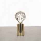 modern-crystal-glass-sphere-table-lamp-with-polished-brass-base-and-warm-led-glow