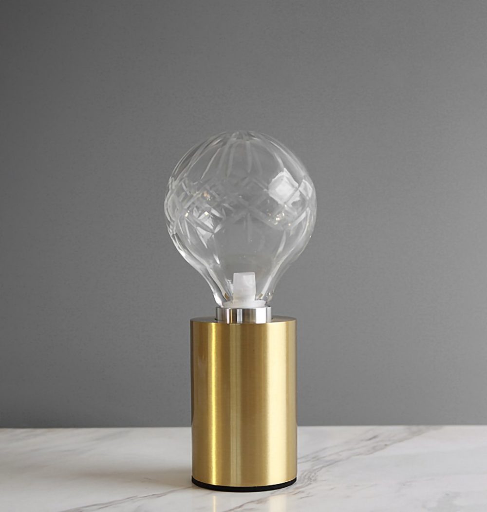 modern-crystal-glass-sphere-table-lamp-with-polished-brass-base-and-warm-led-glow
