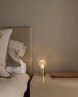 modern-crystal-glass-sphere-table-lamp-with-polished-brass-base-and-warm-led-glow