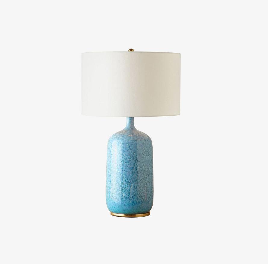 blue-ceramic-table-lamp-with-reactive-glaze-finish-and-white-linen-drum-shade