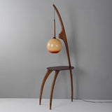 Modern Curved Mantis Wood Floor Lamp with Amber Glass Orb Shade for Living Room and Bedroom