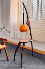 Modern Curved Mantis Wood Floor Lamp with Amber Glass Orb Shade for Living Room and Bedroom