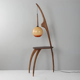Modern Curved Mantis Wood Floor Lamp with Amber Glass Orb Shade for Living Room and Bedroom