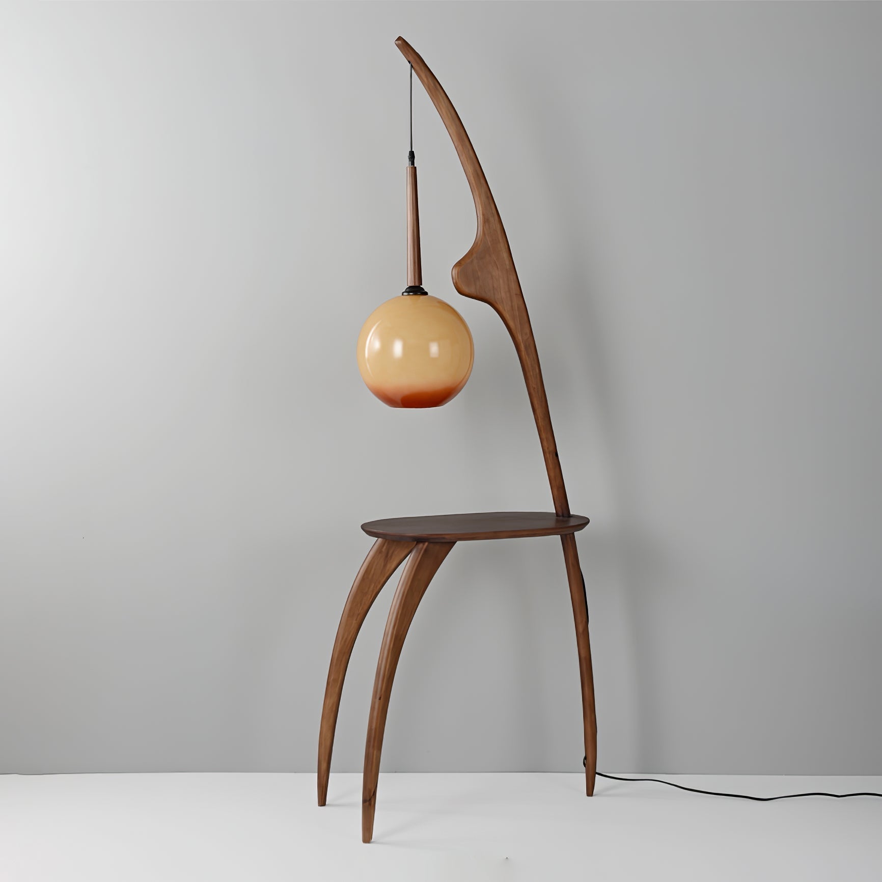 Modern Curved Mantis Wood Floor Lamp with Amber Glass Orb Shade for Living Room and Bedroom