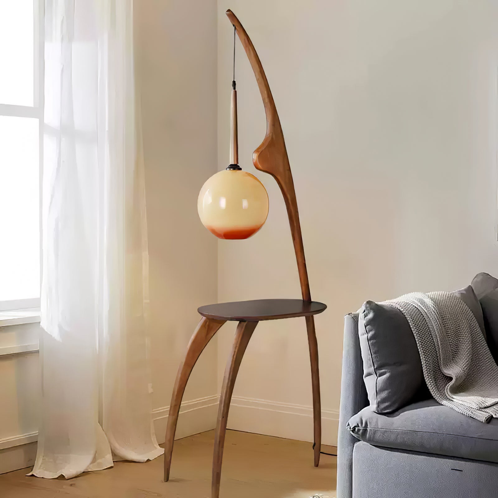 Modern Curved Mantis Wood Floor Lamp with Amber Glass Orb Shade for Living Room and Bedroom