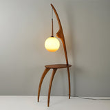 Modern Curved Mantis Wood Floor Lamp with Amber Glass Orb Shade for Living Room and Bedroom
