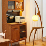 Modern Curved Mantis Wood Floor Lamp with Amber Glass Orb Shade for Living Room and Bedroom