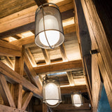 modern-industrial-black-cage-pendant-light-with-oval-fiberglass-shade-for-living-room