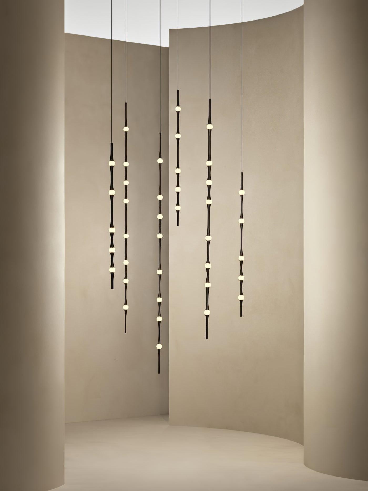dew-explores-modern-linear-led-pendant-light-with-organic-oval-points-for-stairwells