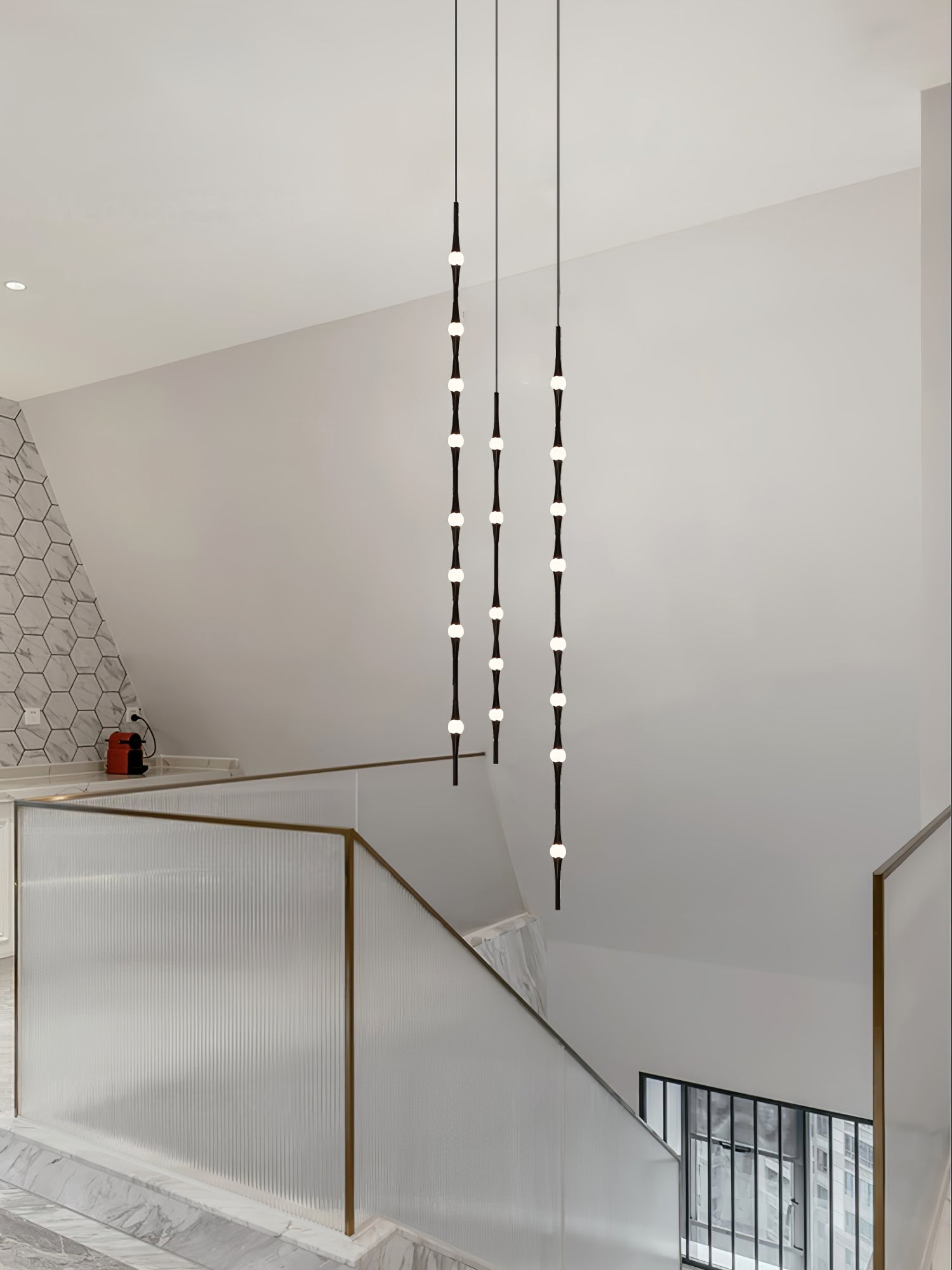dew-explores-modern-linear-led-pendant-light-with-organic-oval-points-for-stairwells