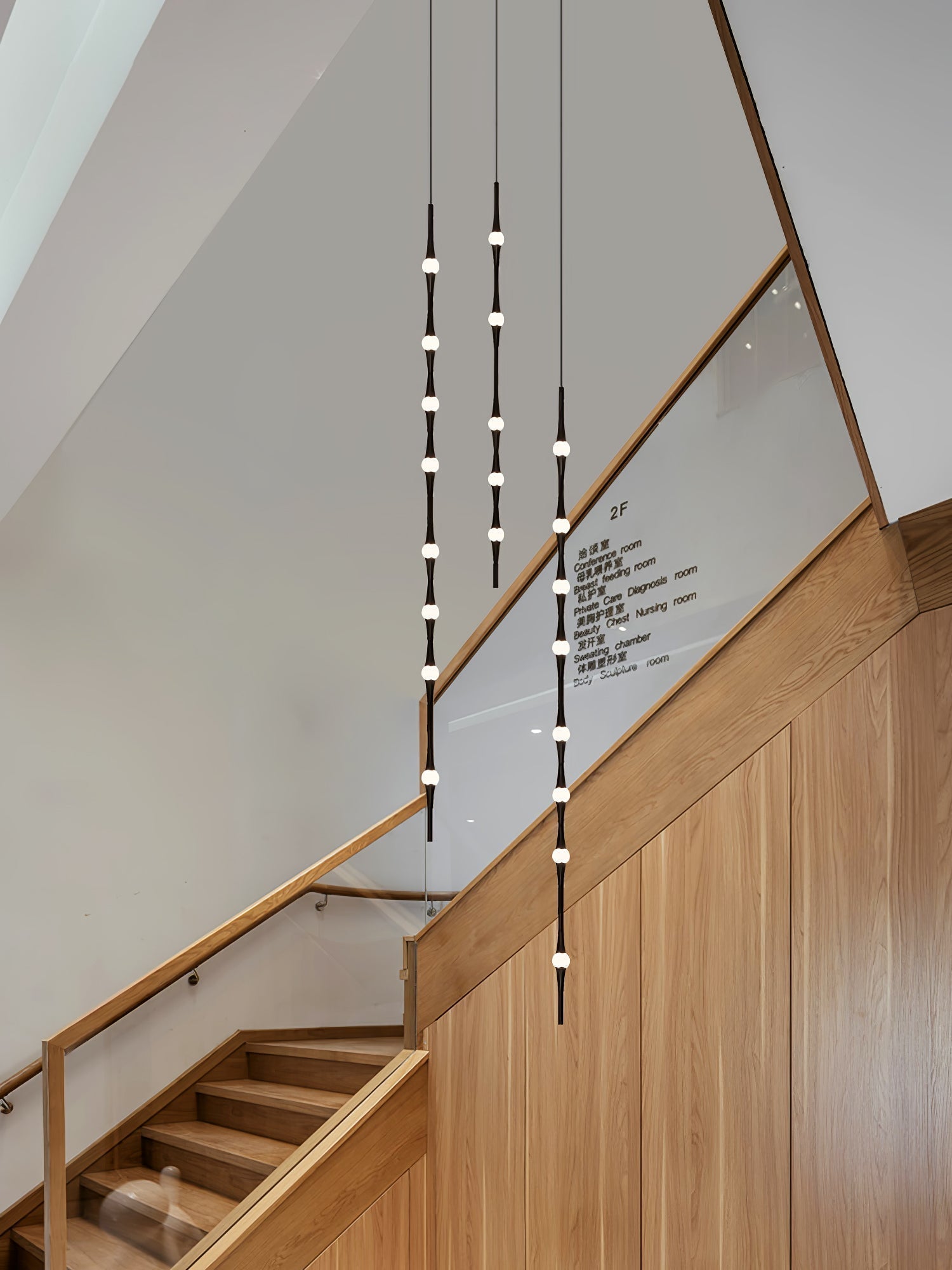 dew-explores-modern-linear-led-pendant-light-with-organic-oval-points-for-stairwells
