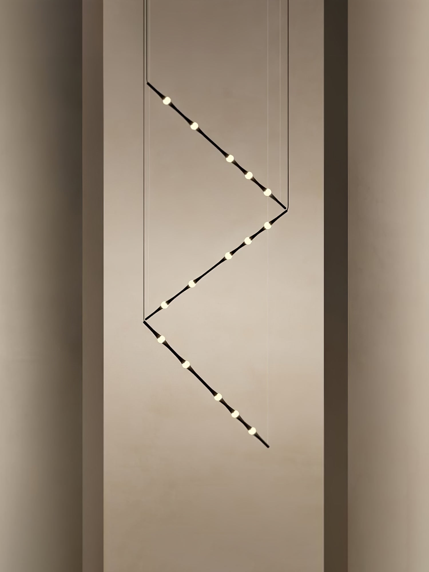 dew-explores-modern-linear-led-pendant-light-with-organic-oval-points-for-stairwells
