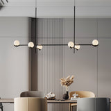 modern-metal-and-glass-globe-pendant-light-for-dining-room-in-gold-and-black-finish