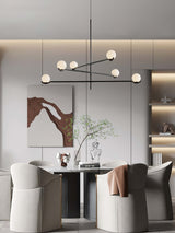 modern-metal-and-glass-globe-pendant-light-for-dining-room-in-gold-and-black-finish