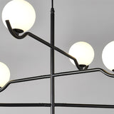 modern-metal-and-glass-globe-pendant-light-for-dining-room-in-gold-and-black-finish