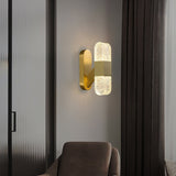 modern-luxury-oval-glass-wall-sconce-with-textured-ice-glass-and-brass-finish-integrated-led-lighting