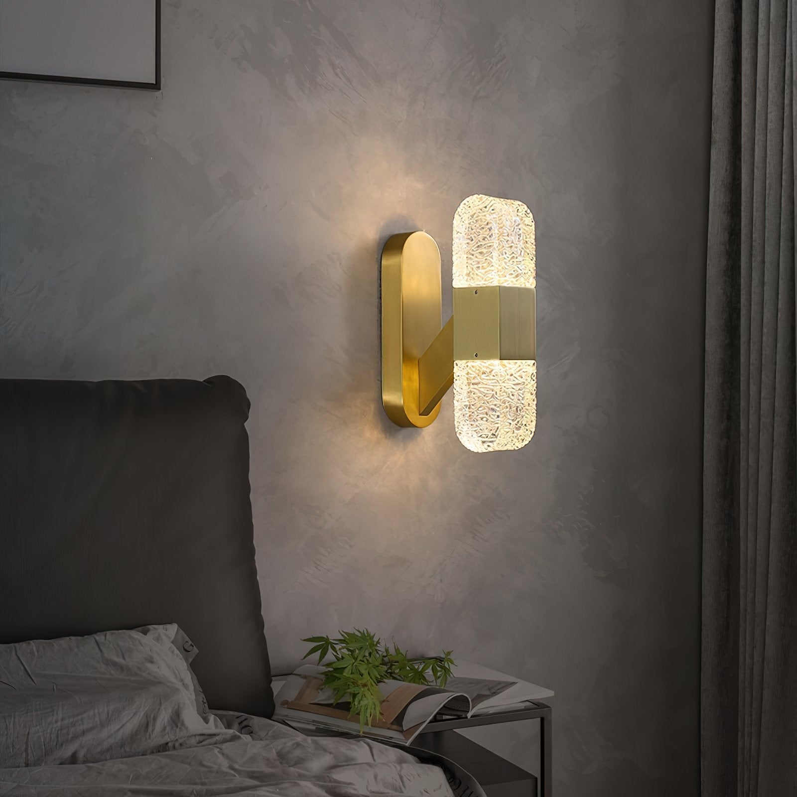 modern-luxury-oval-glass-wall-sconce-with-textured-ice-glass-and-brass-finish-integrated-led-lighting