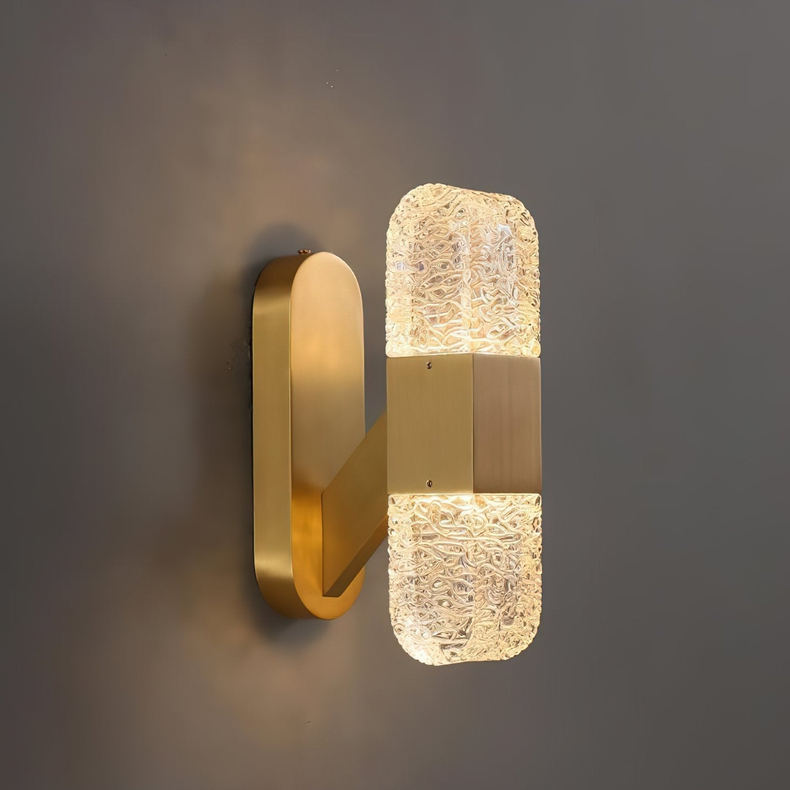 modern-luxury-oval-glass-wall-sconce-with-textured-ice-glass-and-brass-finish-integrated-led-lighting