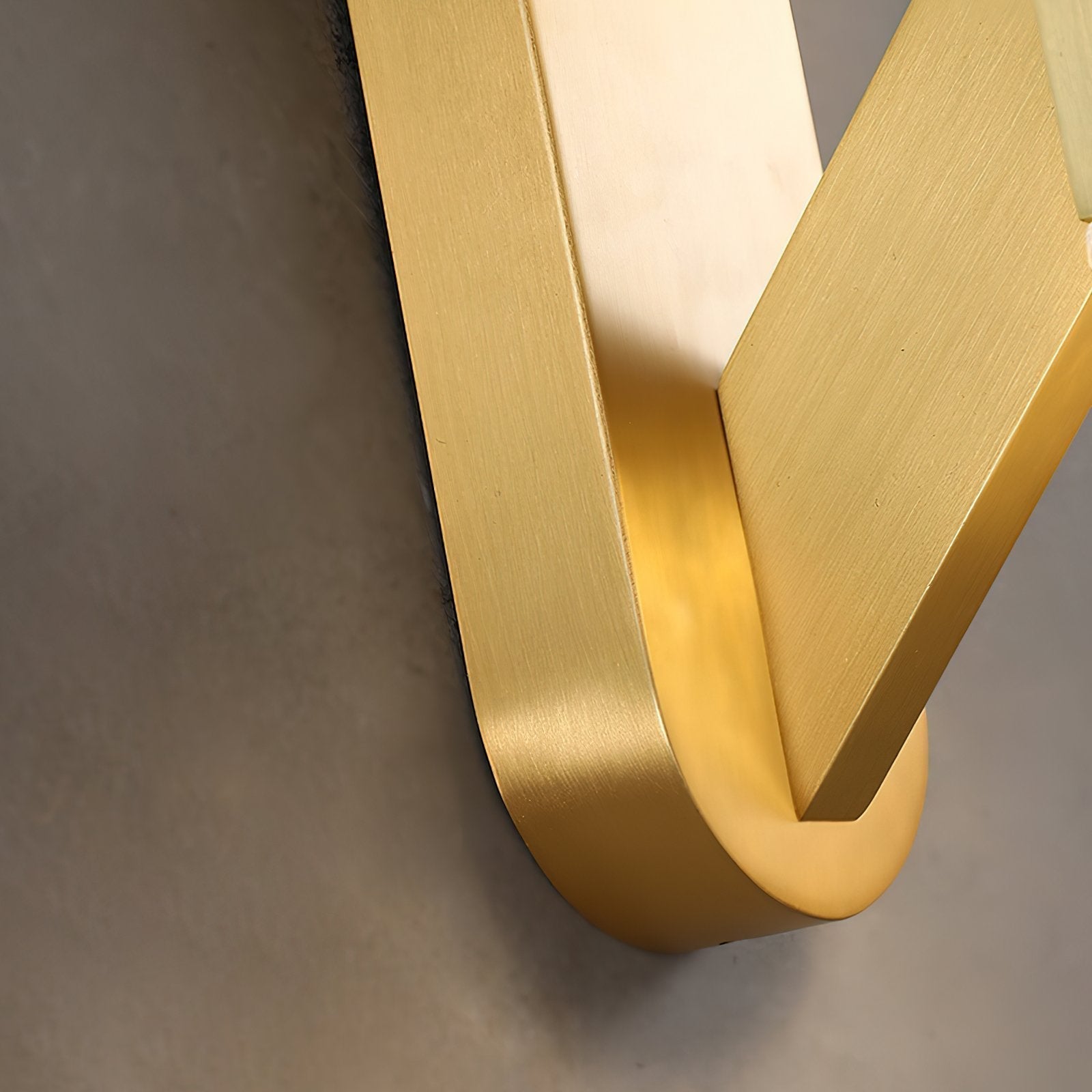 modern-luxury-oval-glass-wall-sconce-with-textured-ice-glass-and-brass-finish-integrated-led-lighting