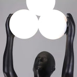 Artistic Humanoid Figure Standing Lamp with Triple Glass Spheres for Modern Living Room