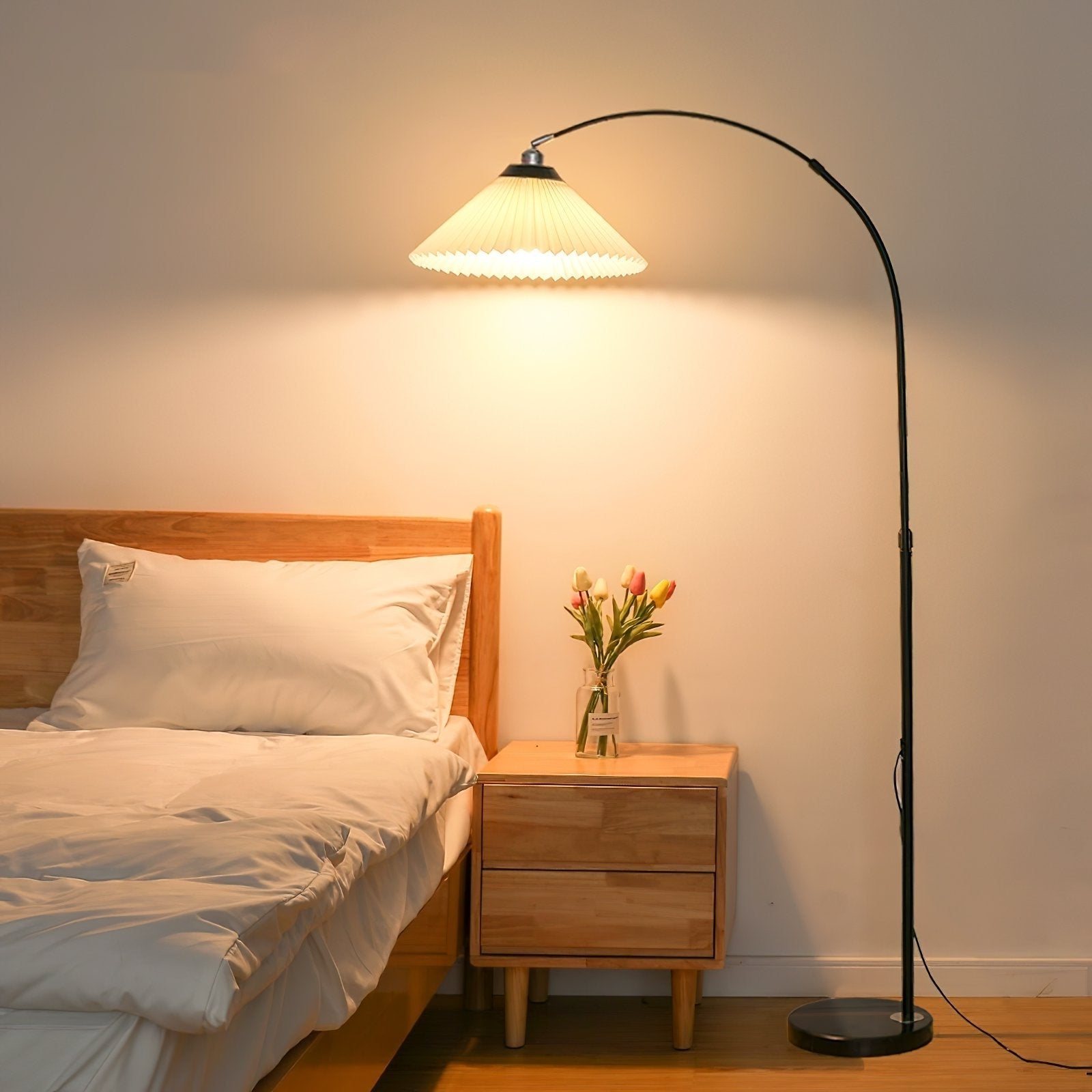 modern-arched-floor-lamp-with-pleated-white-shade-and-matte-black-metal-frame