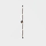 modern-spiral-led-wall-sconce-with-flexible-silicone-curve-and-brass-accents