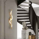 modern-spiral-led-wall-sconce-with-flexible-silicone-curve-and-brass-accents