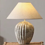 modern-bulbous-ceramic-table-lamp-with-pleated-fluted-texture-and-fabric-shade