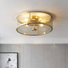 franklin-industrial-brass-and-glass-flush-mount-ceiling-light-for-entryways-and-dining-rooms