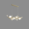 luxury-ginkgo-leaf-linear-chandelier-gold-metal-bar-light-with-white-ceramic-petal-shades