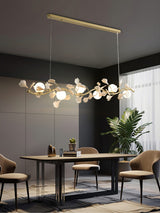 luxury-ginkgo-leaf-linear-chandelier-gold-metal-bar-light-with-white-ceramic-petal-shades