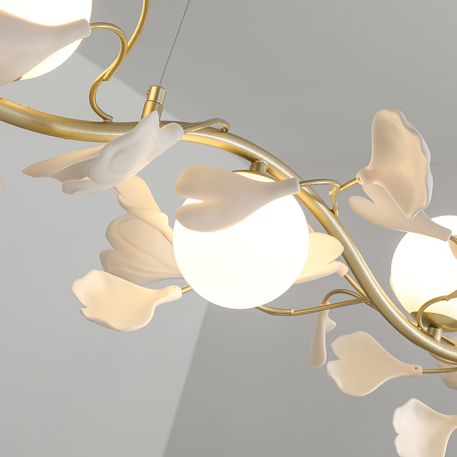 luxury-ginkgo-leaf-linear-chandelier-gold-metal-bar-light-with-white-ceramic-petal-shades