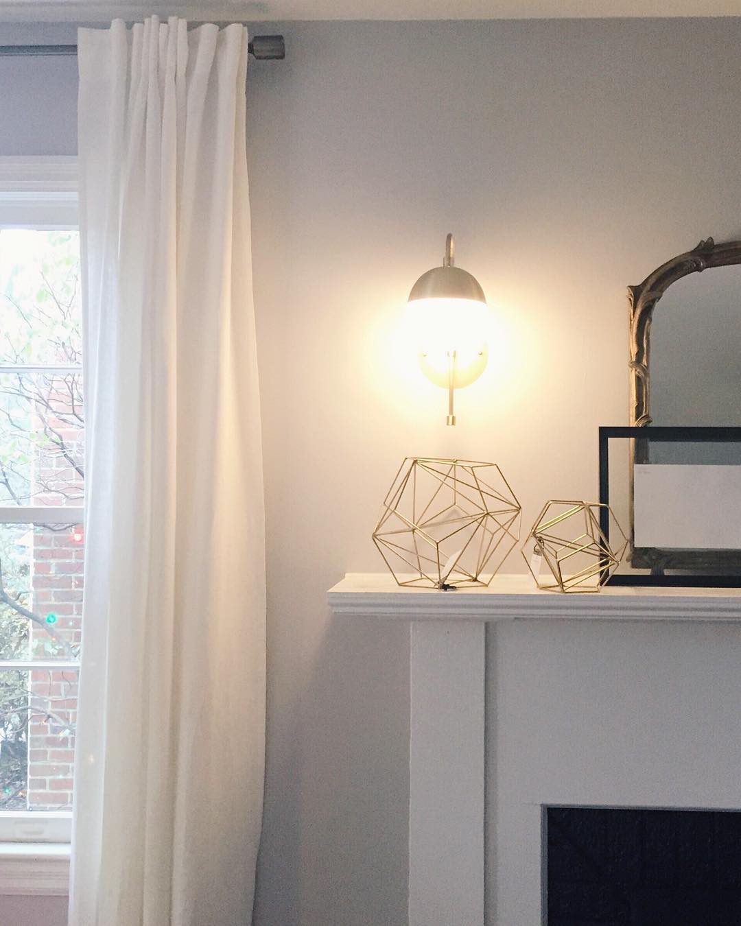 elegant-opaque-glass-globe-wall-sconce-with-brass-finish-modern-indoor-lighting-for-bedrooms-and-living-rooms