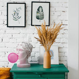 Modern Grace Portable Table Lamp with Pink Glass Globe and White Resin Bust Sculptural Base