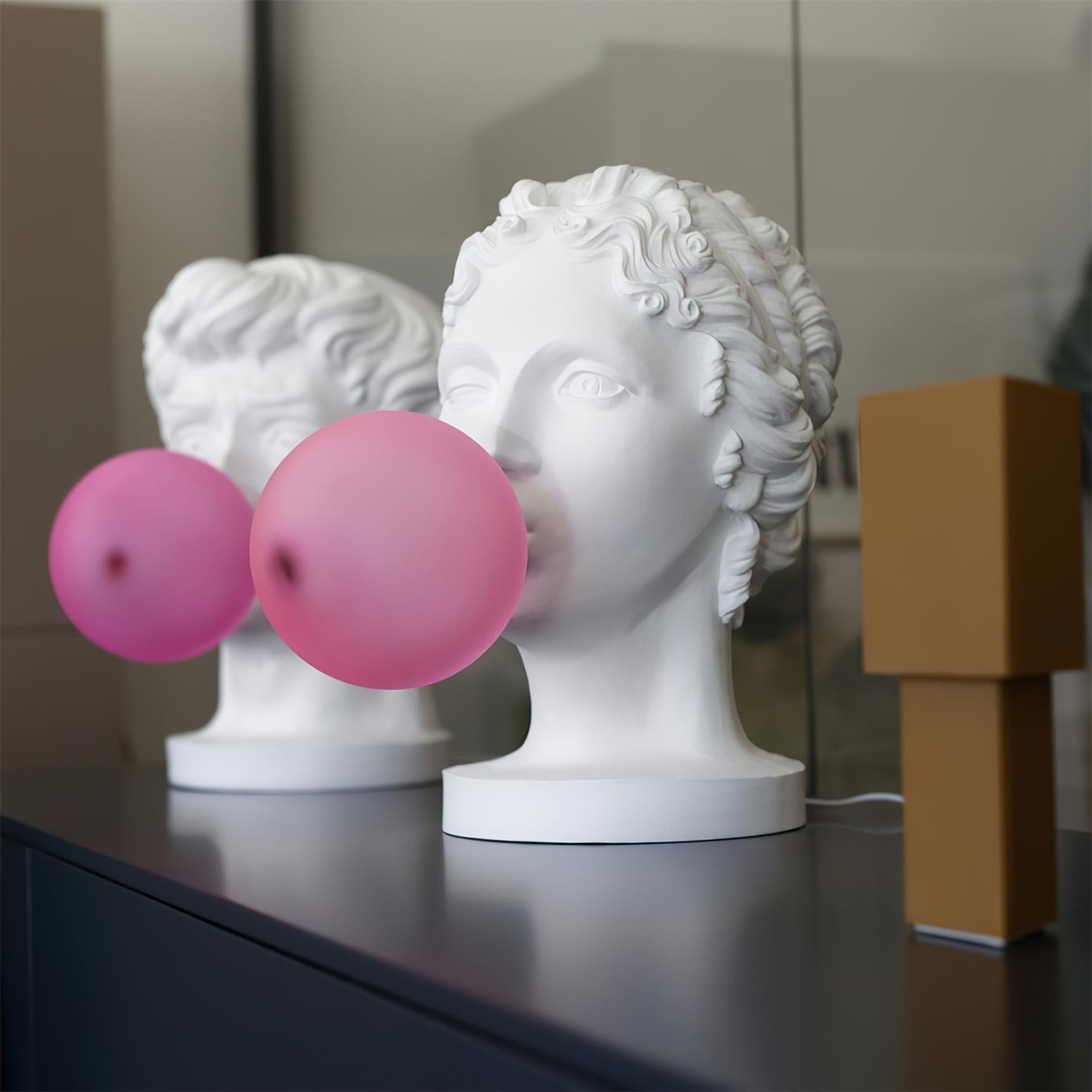 Modern Grace Portable Table Lamp with Pink Glass Globe and White Resin Bust Sculptural Base