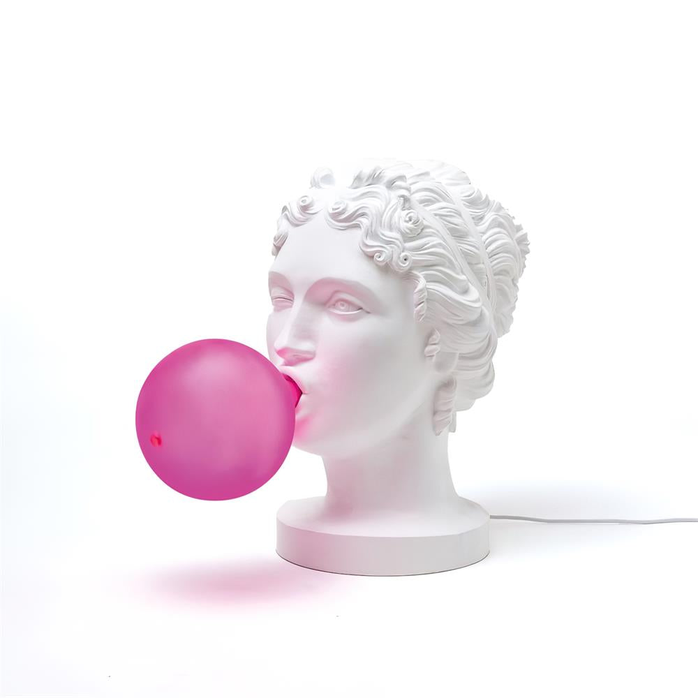 Modern Grace Portable Table Lamp with Pink Glass Globe and White Resin Bust Sculptural Base