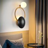 modern-geometric-circle-design-wall-sconce-gold-and-black-indoor-accent-lighting