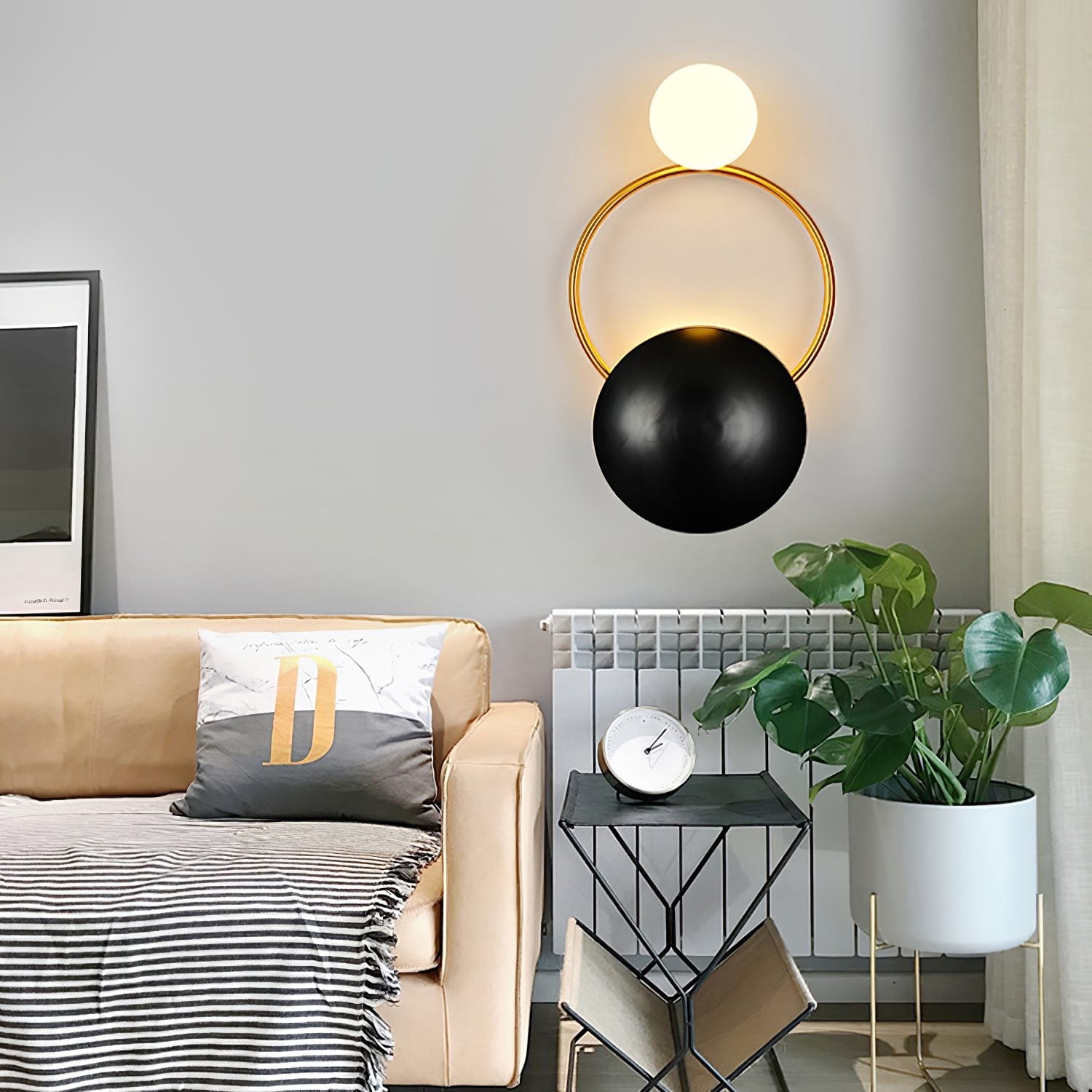 modern-geometric-circle-design-wall-sconce-gold-and-black-indoor-accent-lighting