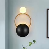 modern-geometric-circle-design-wall-sconce-gold-and-black-indoor-accent-lighting