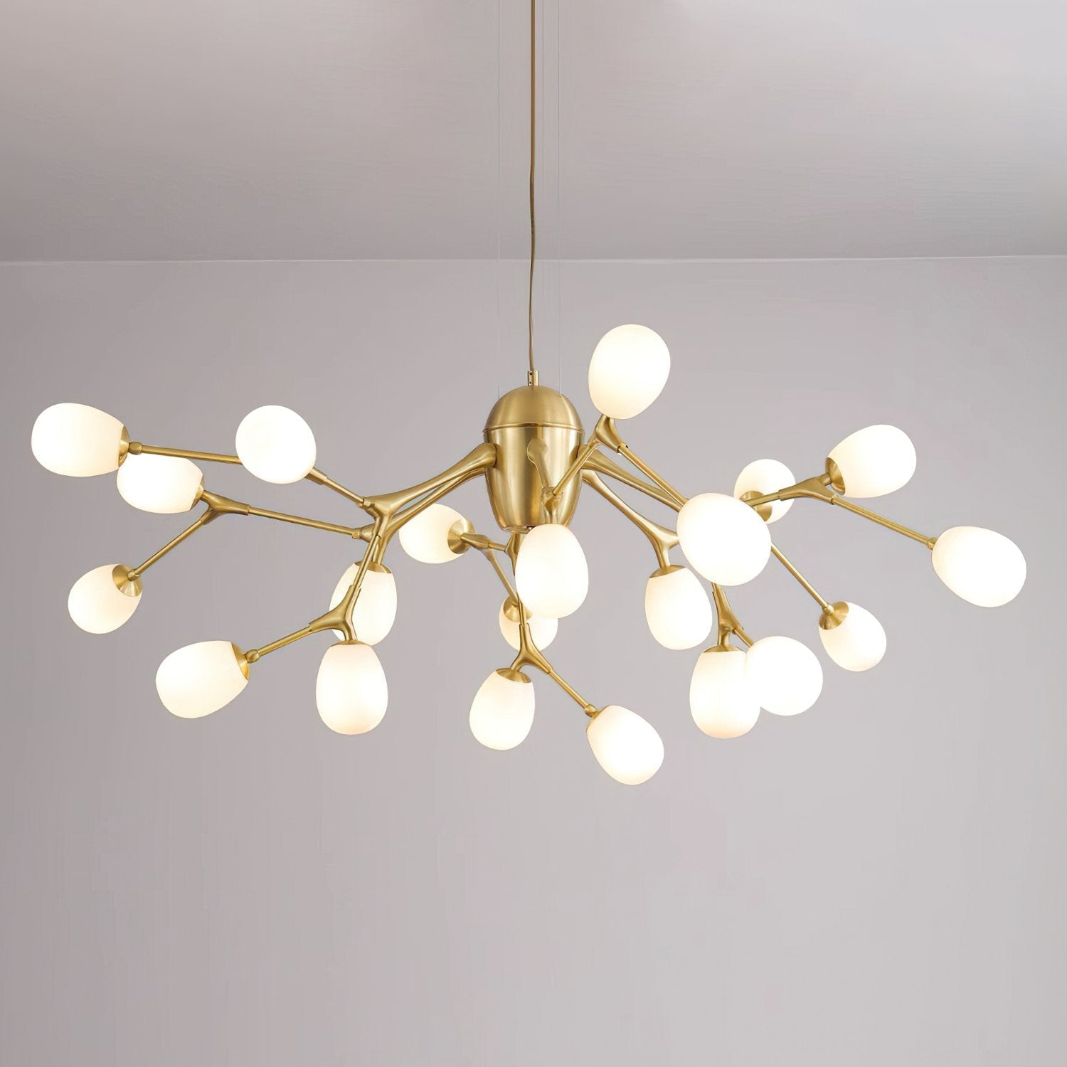 modern-brass-chandelier-with-pearl-glass-shades-and-elegant-curved-arms