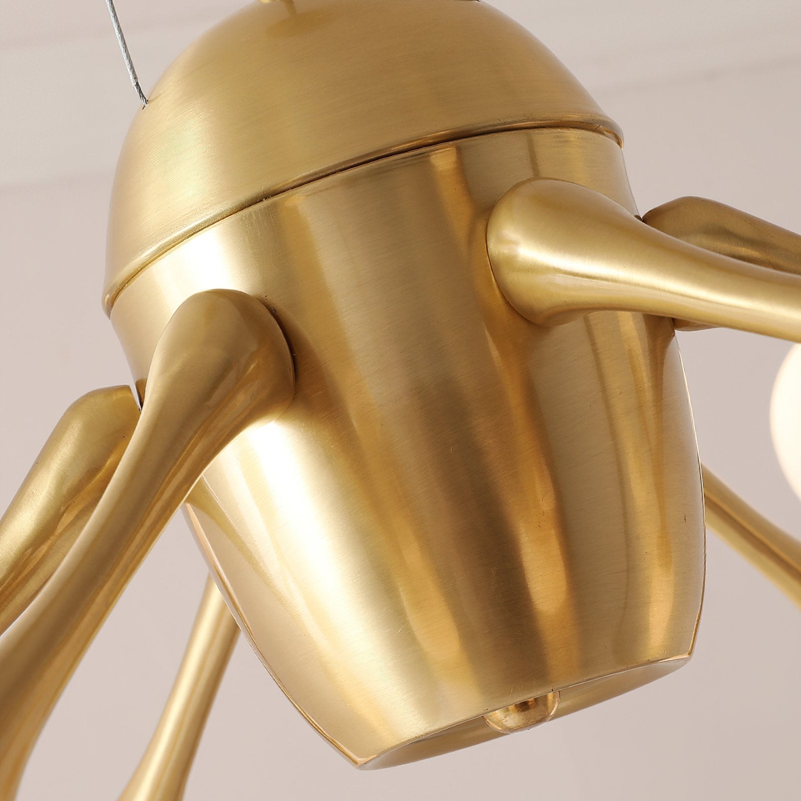 modern-brass-chandelier-with-pearl-glass-shades-and-elegant-curved-arms