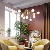 modern-brass-chandelier-with-pearl-glass-shades-and-elegant-curved-arms