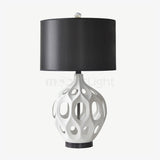 modern-ceramic-table-lamp-with-hollow-design-and-fabric-drum-shade-for-elegant-interior-lighting-decor