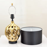 modern-ceramic-table-lamp-with-hollow-design-and-fabric-drum-shade-for-elegant-interior-lighting-decor