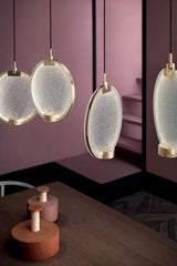 modern-circular-glass-pendant-light-with-brass-finish-and-integrated-led-spotlight