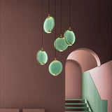 modern-circular-glass-pendant-light-with-brass-finish-and-integrated-led-spotlight
